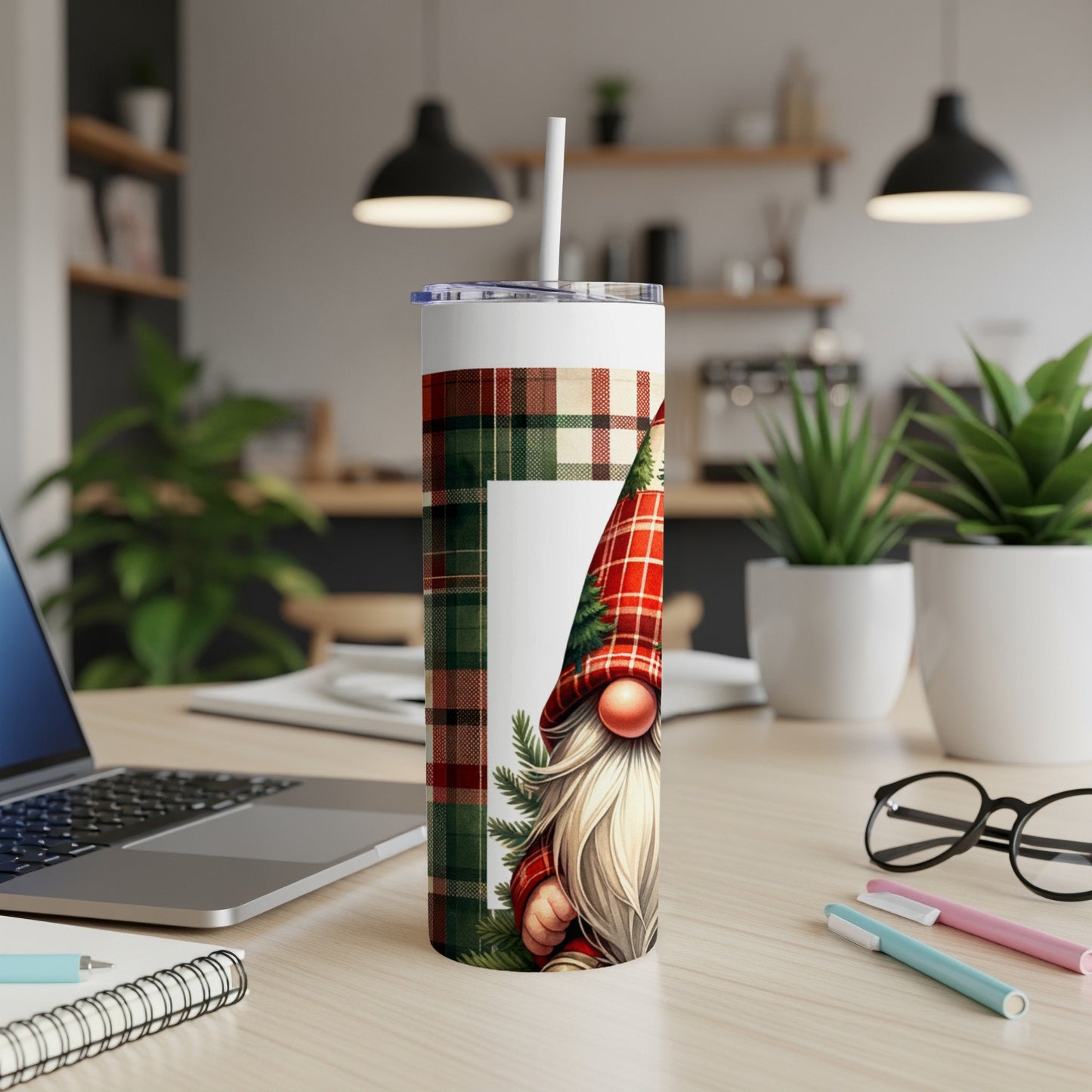 Christmas gnome on a plaid tumbler with a white straw.