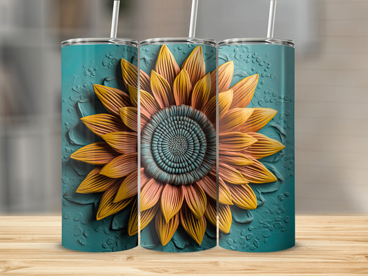 Teal tumbler with embossed sunflower design and straw.