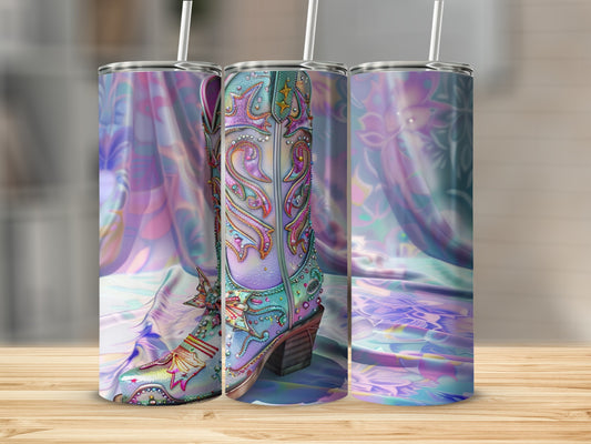 Cowboy boot tumbler with ornate stitching and a iridescent, patterned background.