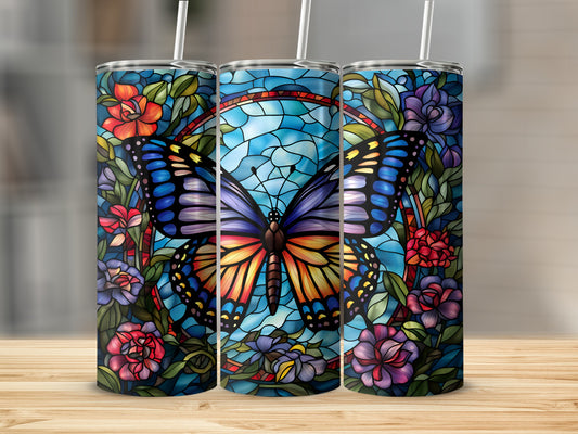 Stained glass butterfly and floral design on three tumblers.
