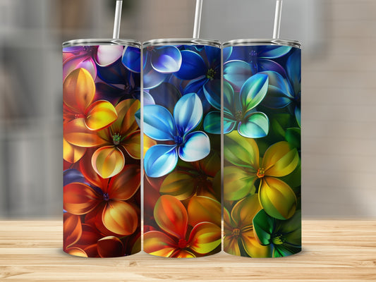 Three tumblers with colorful floral designs in gradient hues.