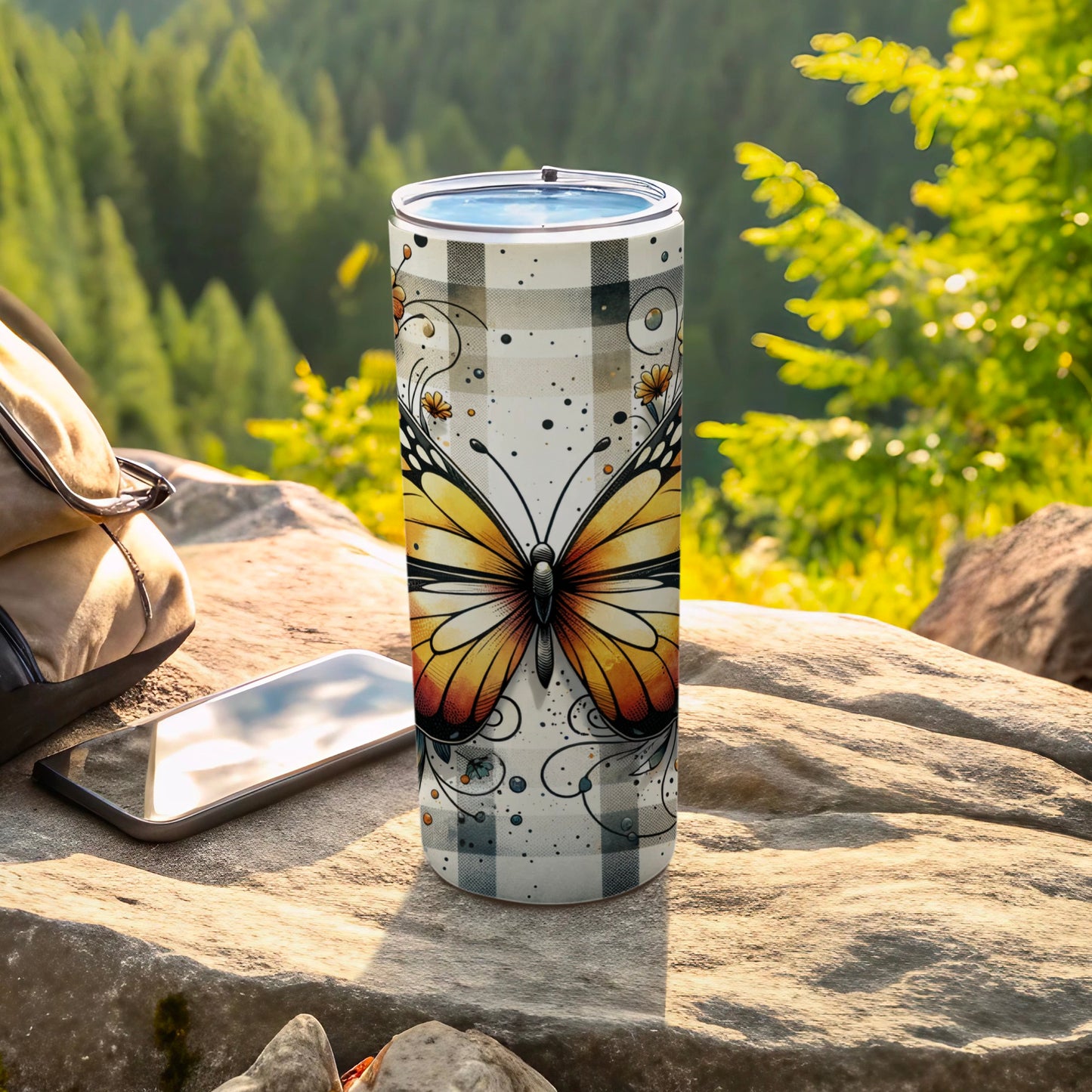 White and black buffalo check tumbler with a yellow butterfly design.