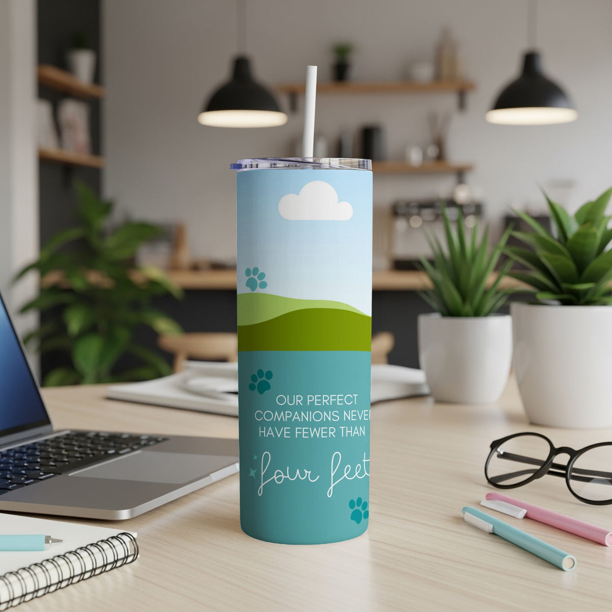 Tumbler with sky, clouds, and hills. Text: "Our perfect companions never have fewer than four feet".