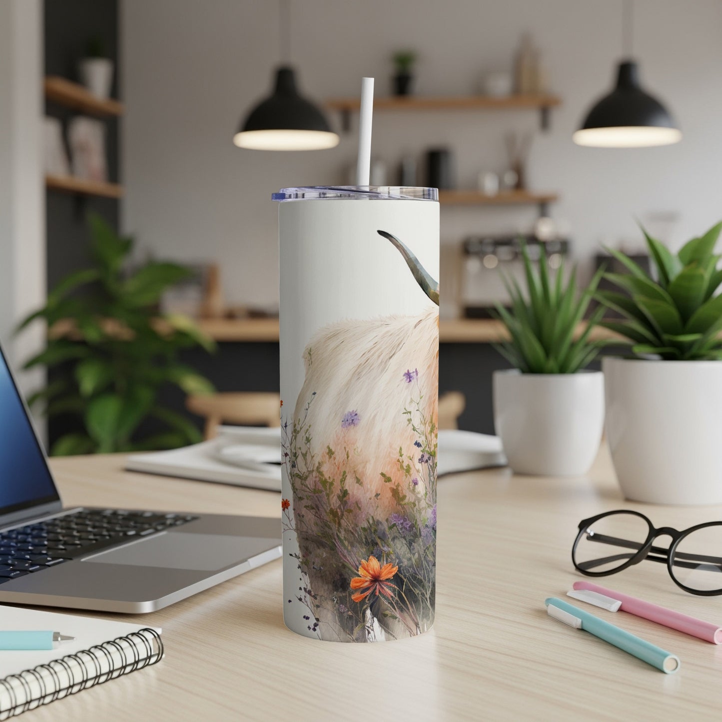 White tumbler with Highland cow and floral watercolor design.