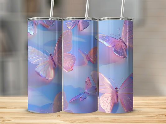 Three tumblers with iridescent butterflies and pastel blue and pink backgrounds.