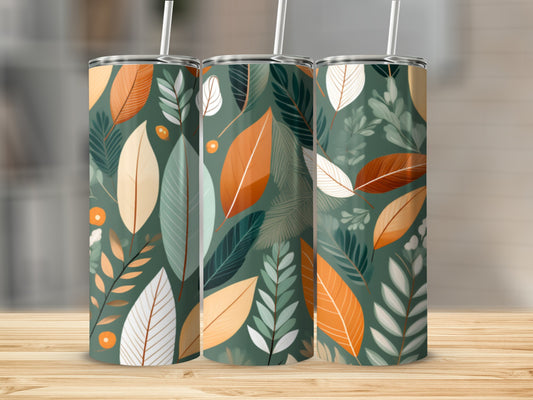 Three tumblers with a green and orange leaf pattern on a wooden surface.