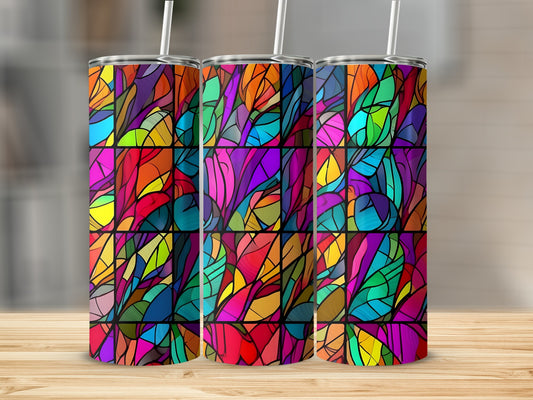 Three tumblers with colorful stained-glass patterns displayed on a wooden surface.