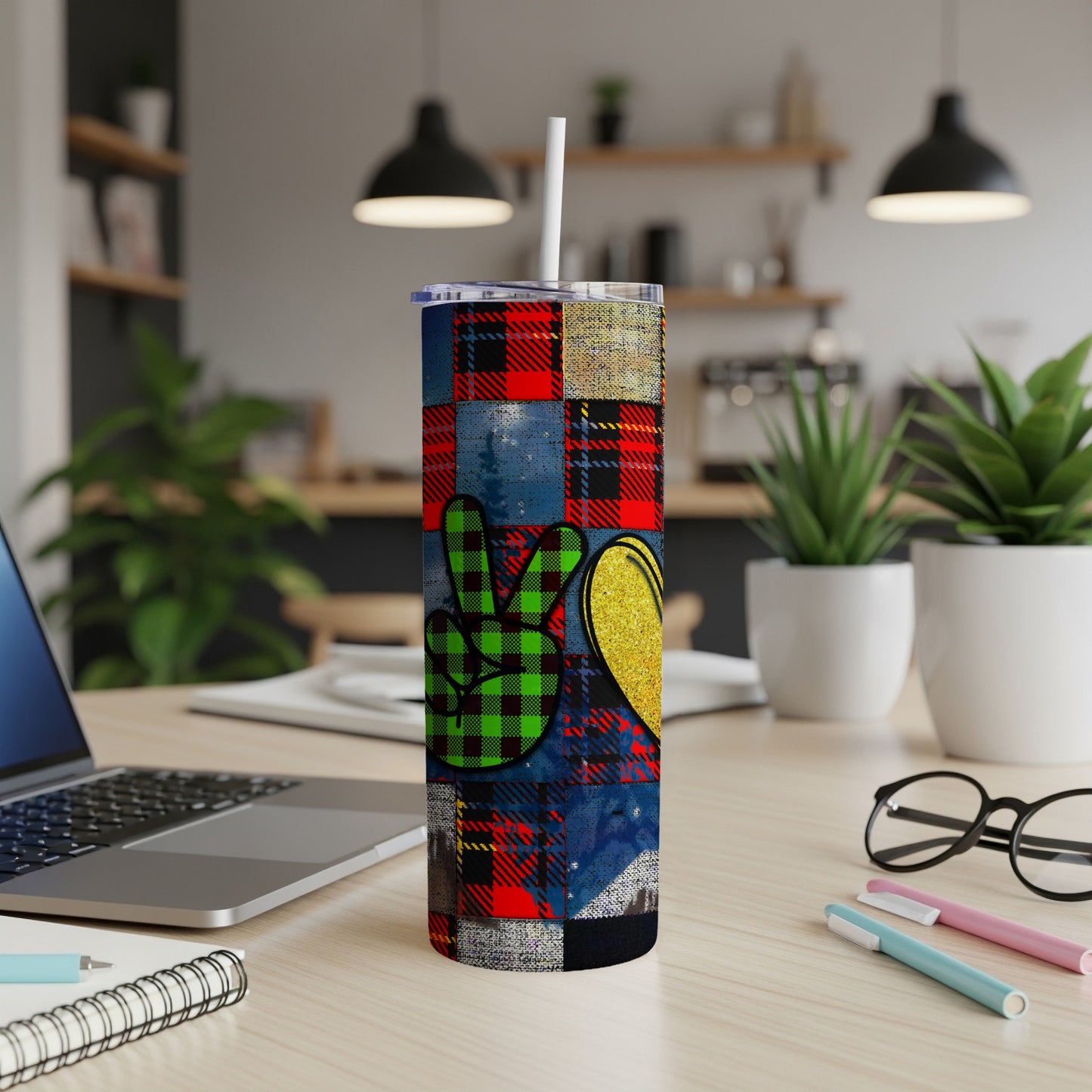 Peace sign and heart pattern on a tumbler with a white straw.