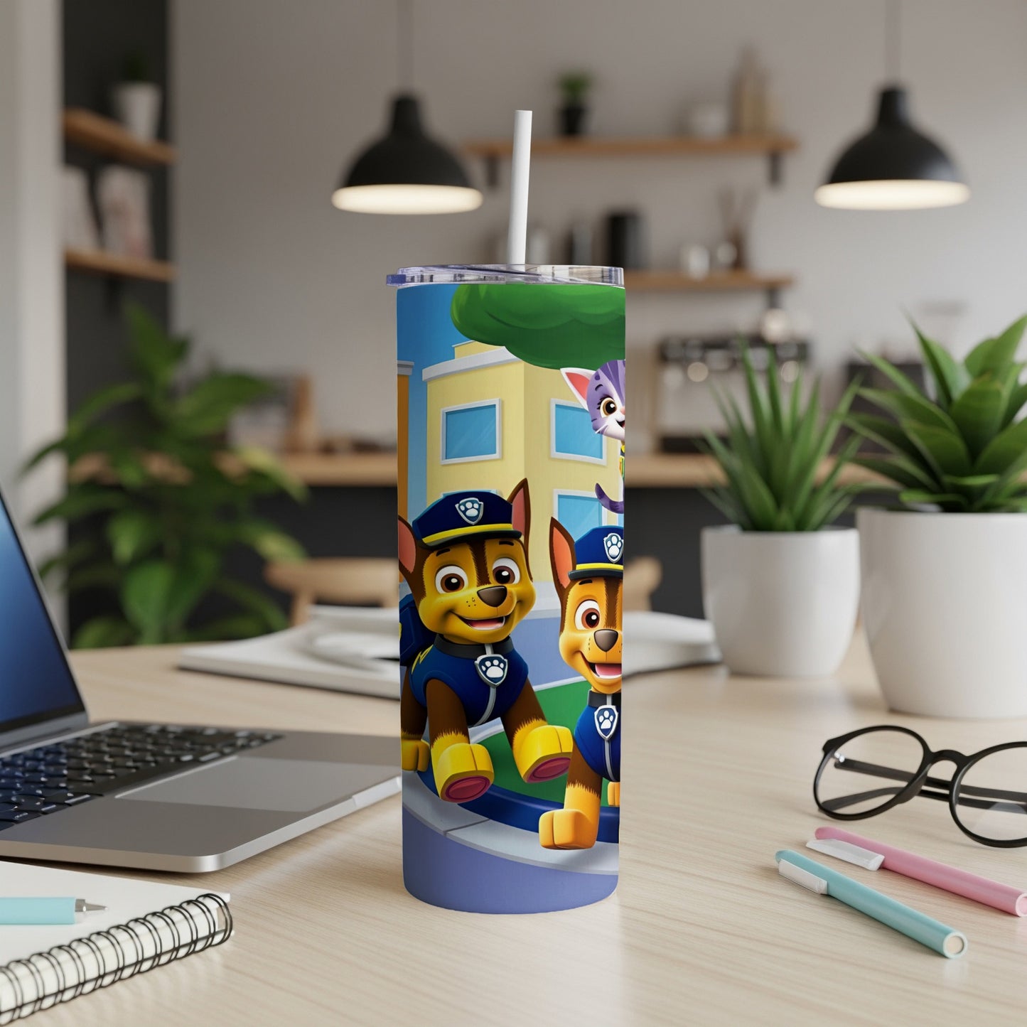 Paw Patrol Chase and Marshall character tumbler with straw on desk.