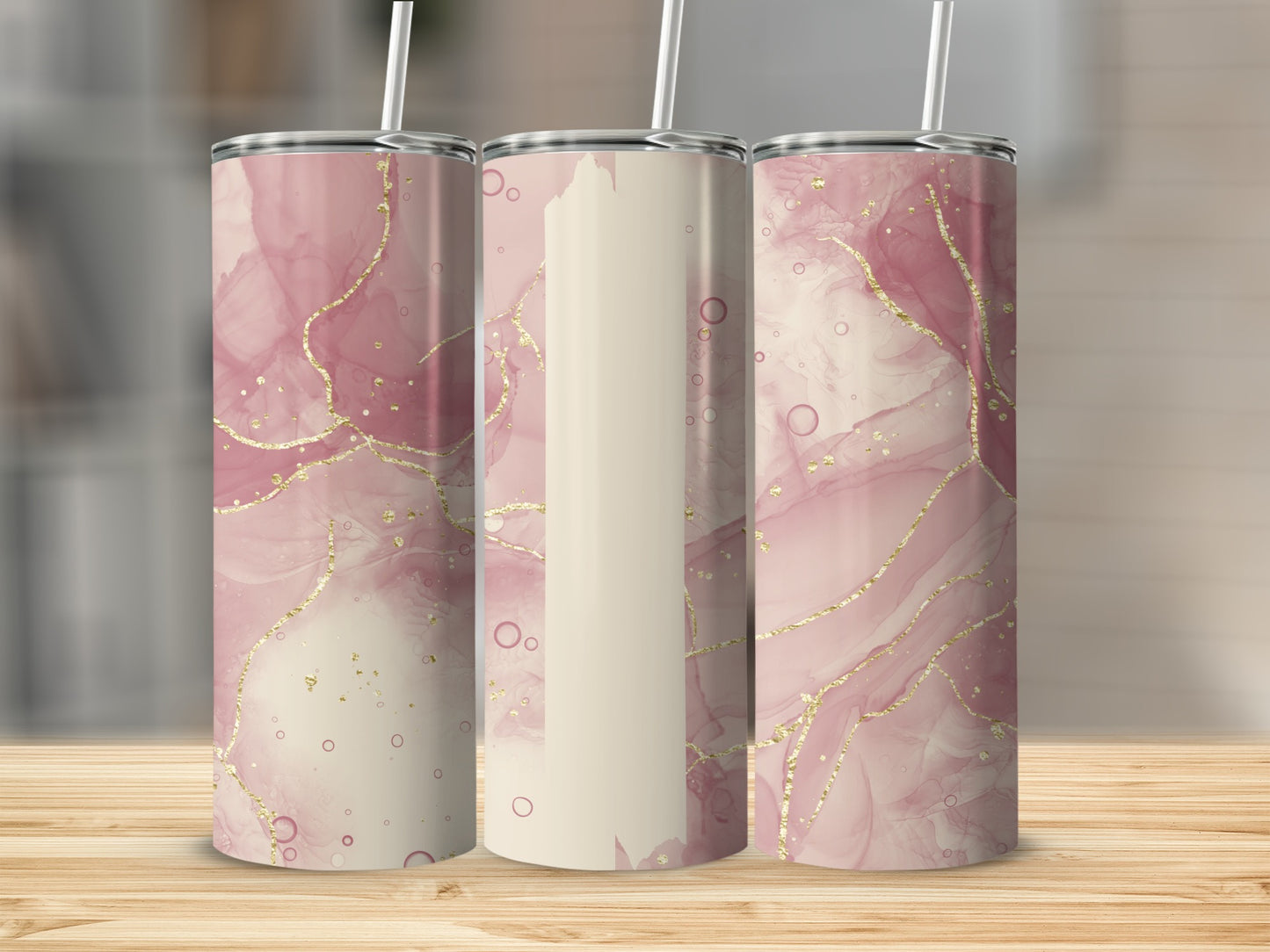 Three tumblers with pink and beige marble and gold accent patterns.