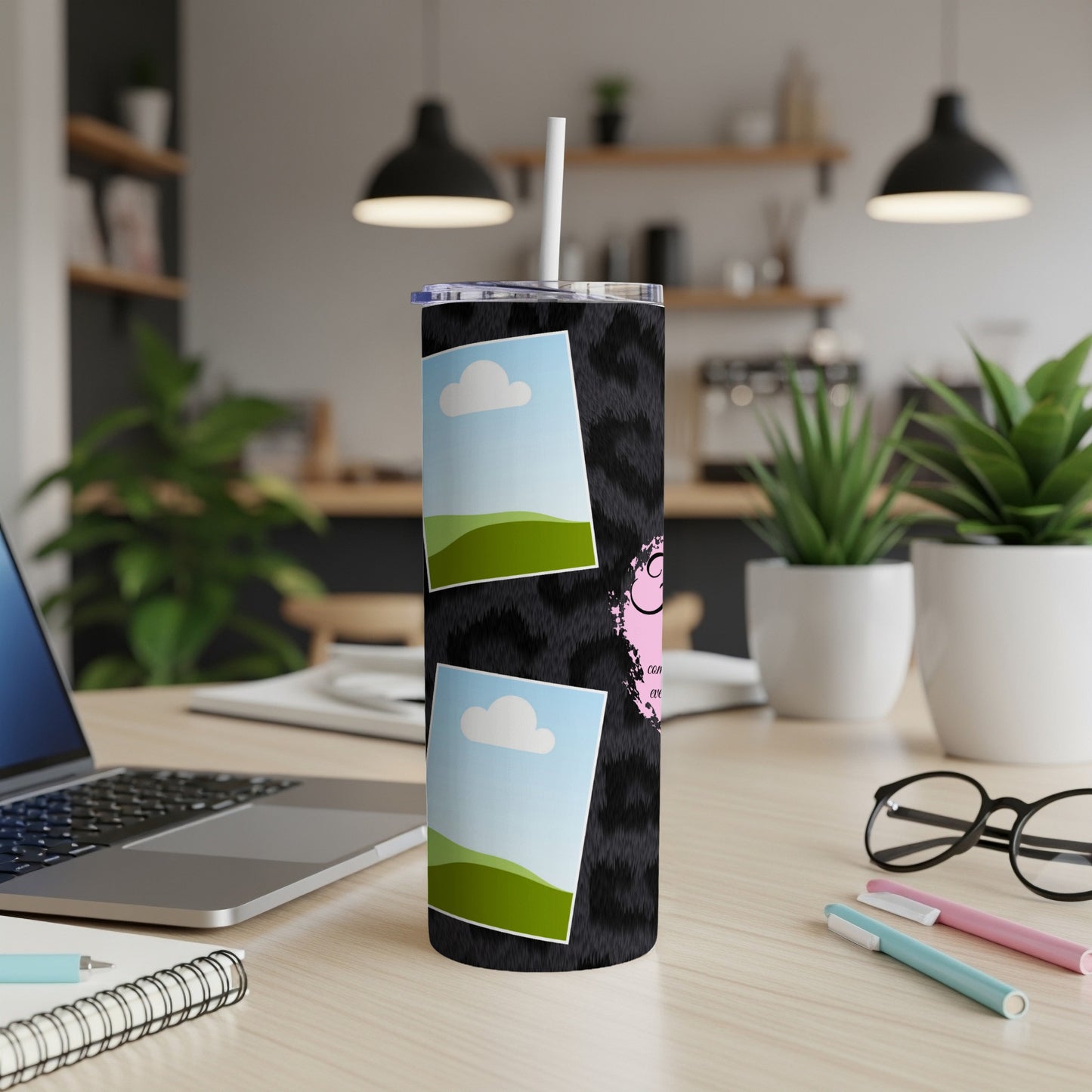 Black fuzzy tumbler with two framed landscape photos and pink text.