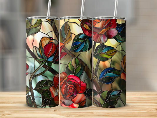 Three tumblers with stained glass rose pattern on a wooden surface.