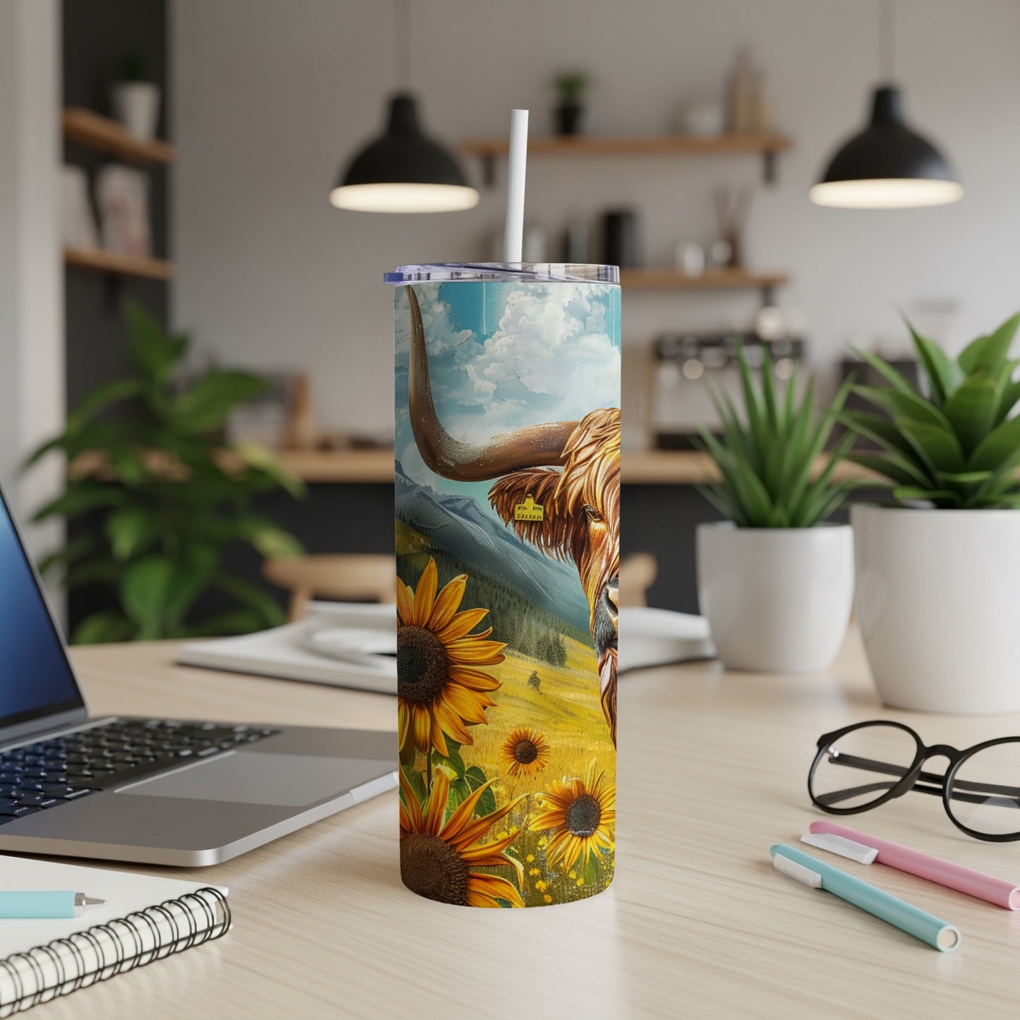 Highland cow and sunflowers on a stainless steel tumbler.