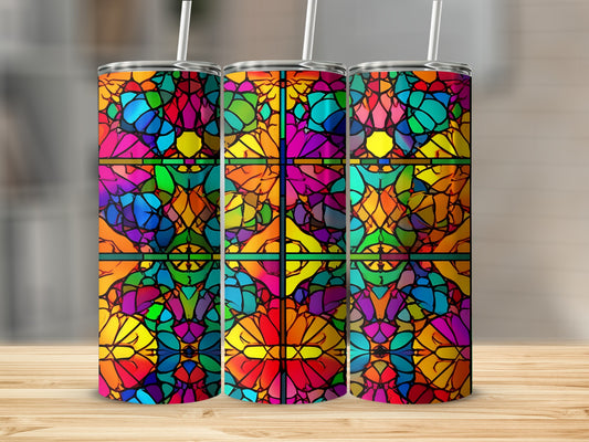 Three tumblers with stained glass mosaic patterns in vibrant colors.
