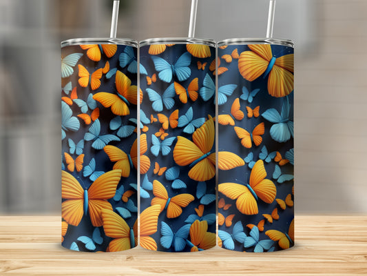 Three tumblers with vibrant orange and blue butterfly patterns.