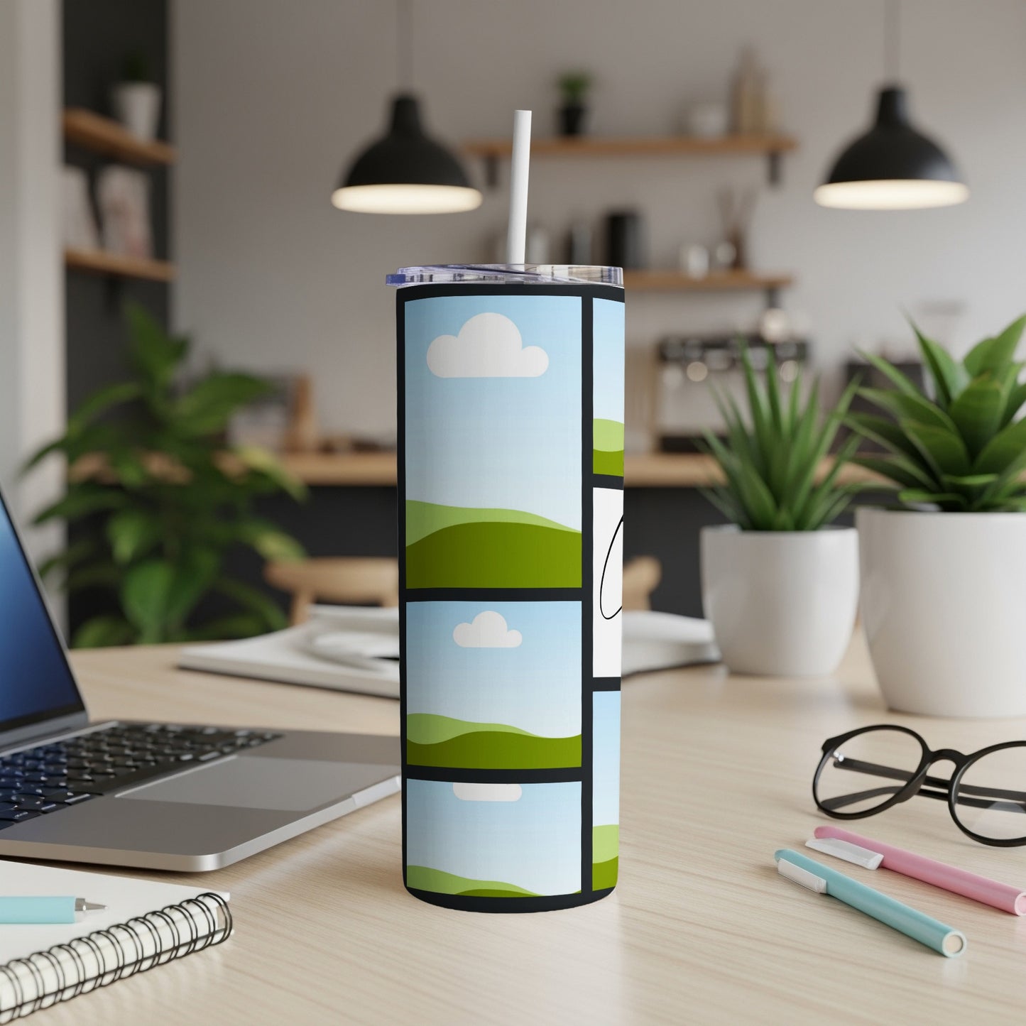 Tall tumbler with a collage of landscape photos and a white straw.