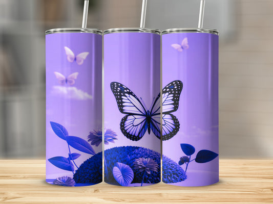 Purple tumbler with butterfly and floral designs on a wooden surface.