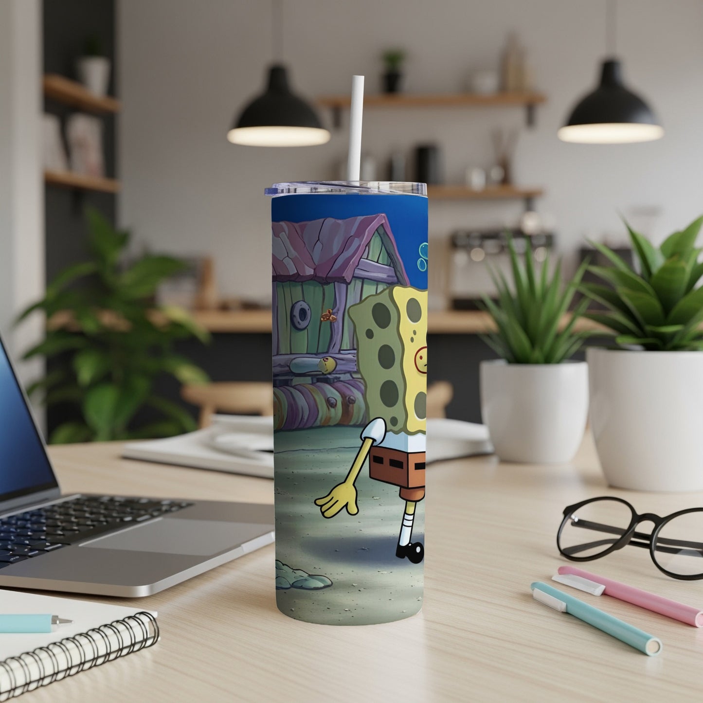 SpongeBob SquarePants character on a tumbler with a straw.