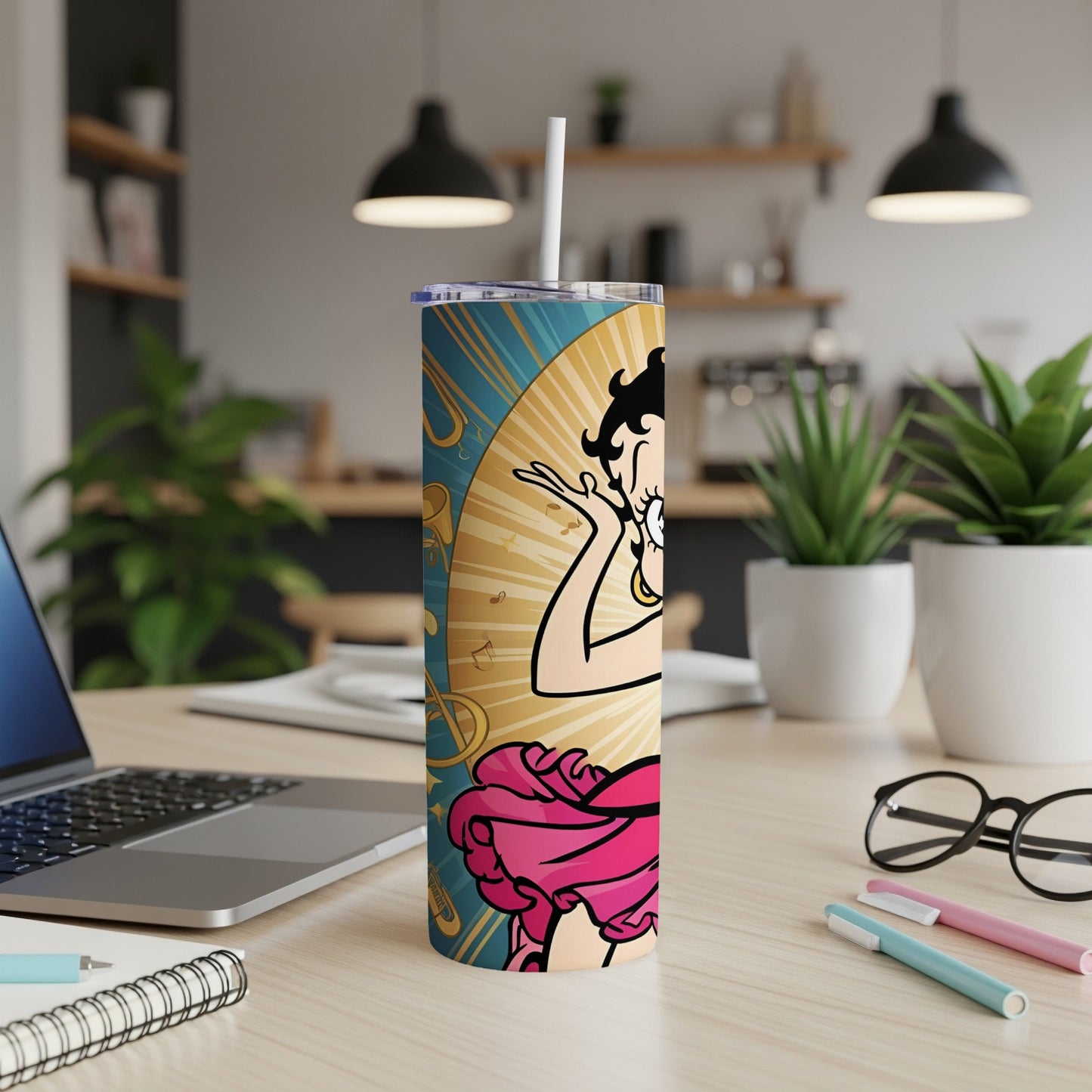 Betty Boop artwork on a blue and gold skinny tumbler.