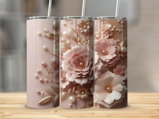 Three pink tumblers adorned with pearl and floral embellishments.