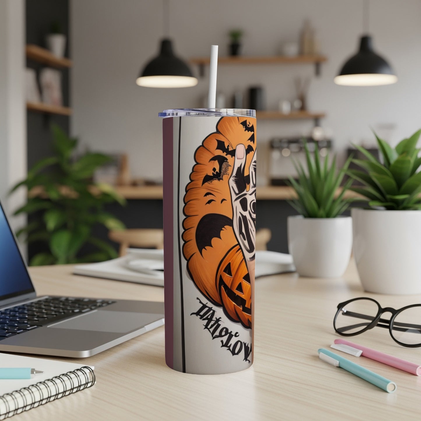 Halloween tumbler with a skeleton hand and pumpkin design and "Trick or Treat" text.