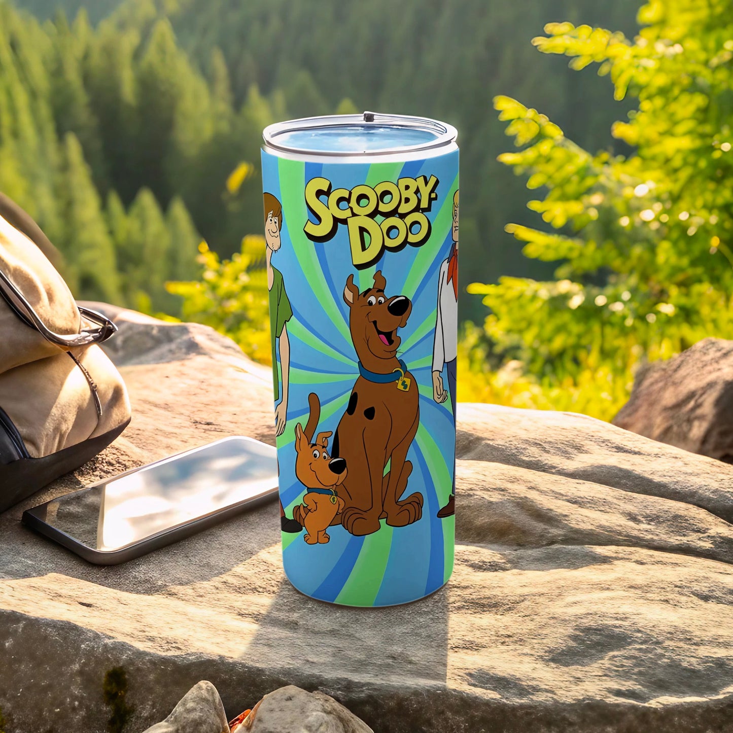 Scooby-Doo characters on a blue and green striped tumbler with a backpack and phone.
