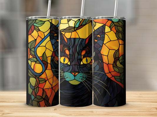 Black cat with yellow eyes on stained glass pattern tumbler.