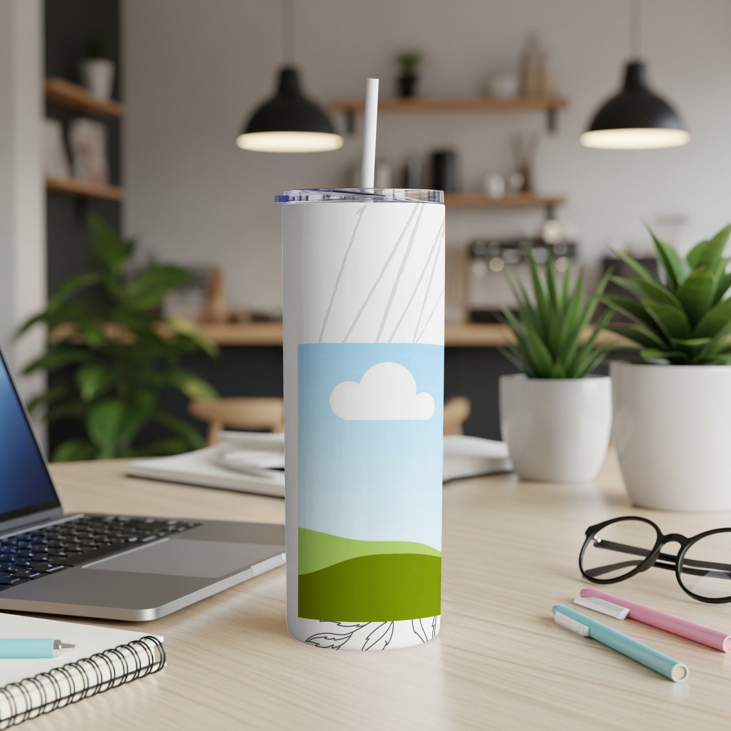 White tumbler with a sky and rolling hills design and abstract lines.