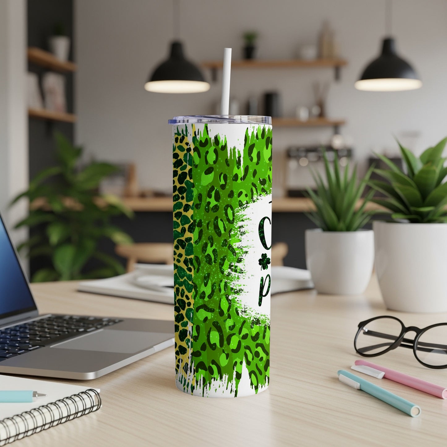 Green and black leopard print tumbler with "Lucky" text on a desk.
