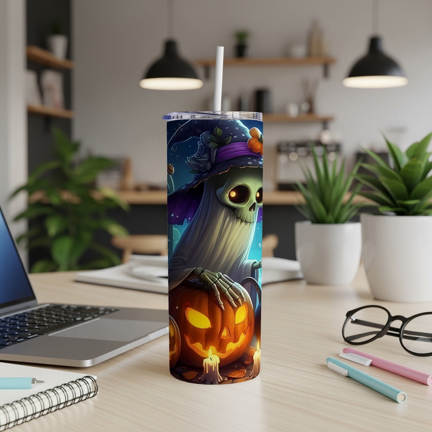 Halloween tumbler with ghost holding pumpkin, lit candles, and witch hat design.