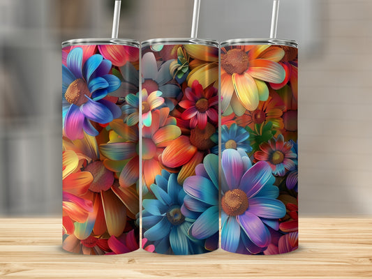 Three colorful floral patterned tumblers on a wooden surface.