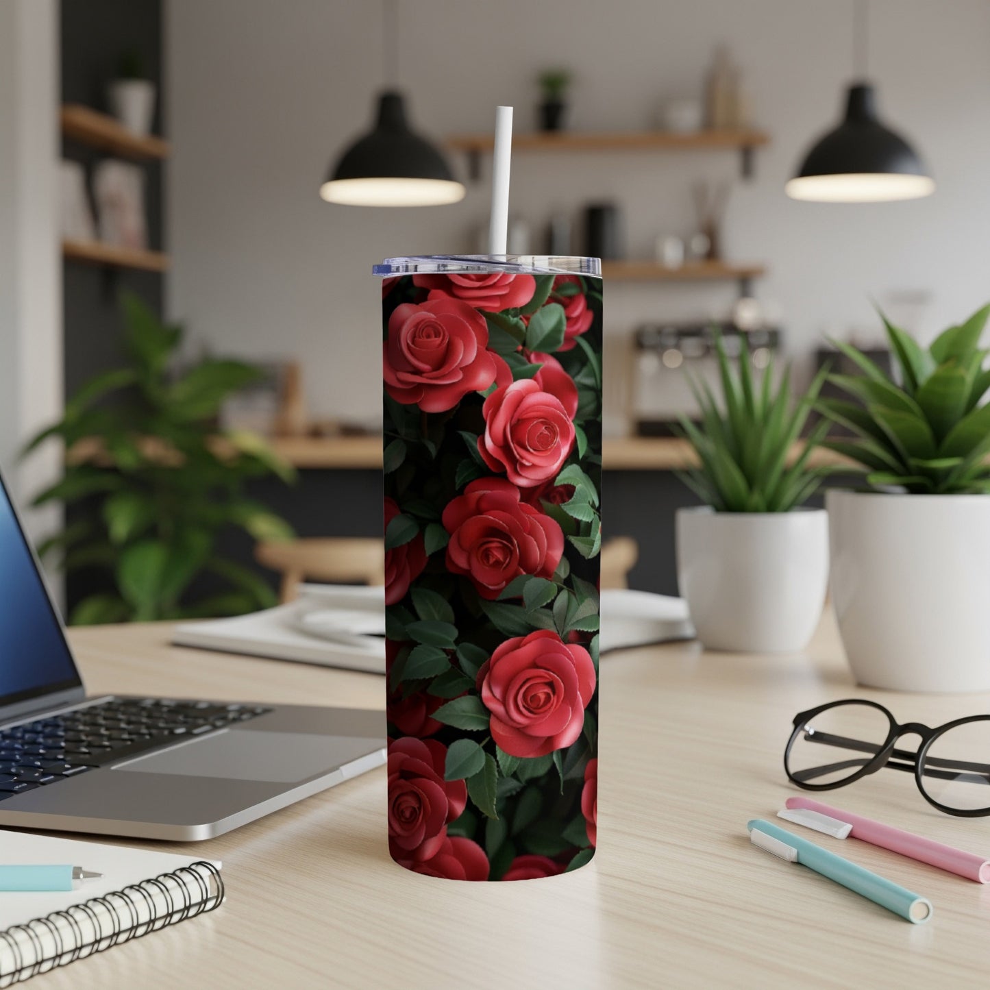 Tumbler with red roses and green leaves design.