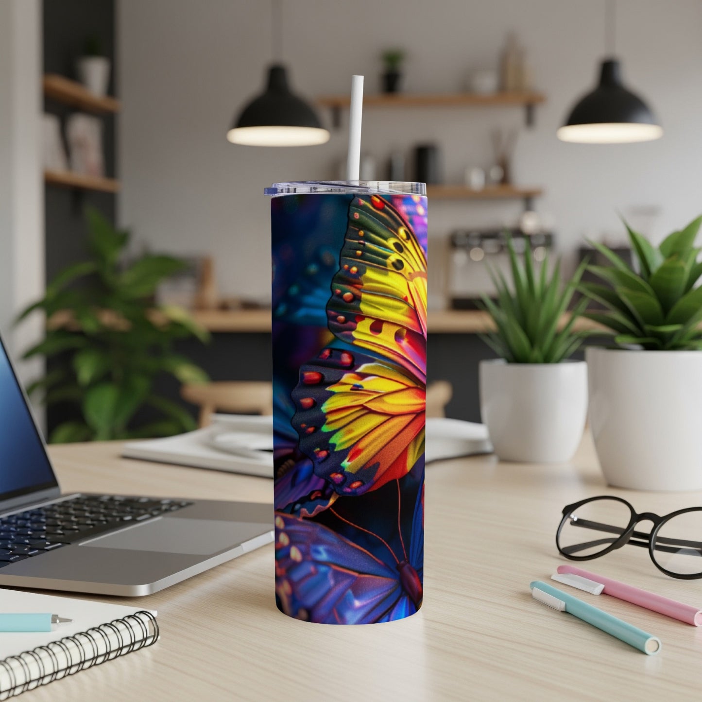Tall tumbler with colorful butterfly wing design.