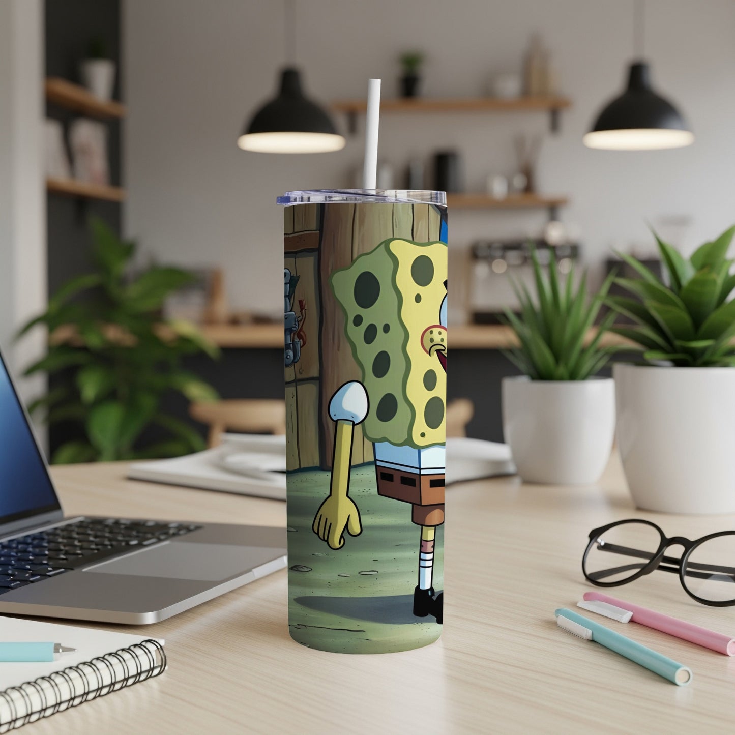 SpongeBob SquarePants character on a white insulated tumbler with a straw.