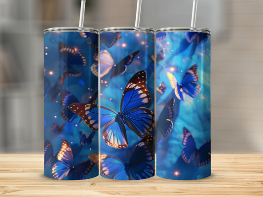 Three tumblers with blue butterflies and bokeh lights.