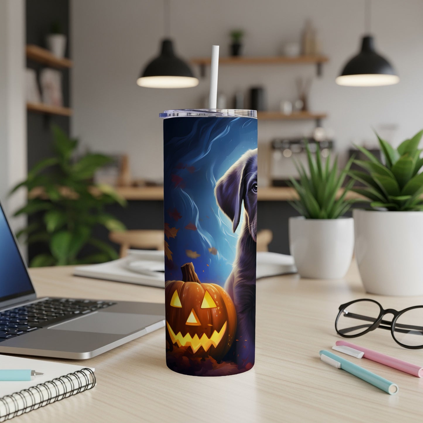 Tumbler with dark dog and lit jack-o'-lantern on a blue background.