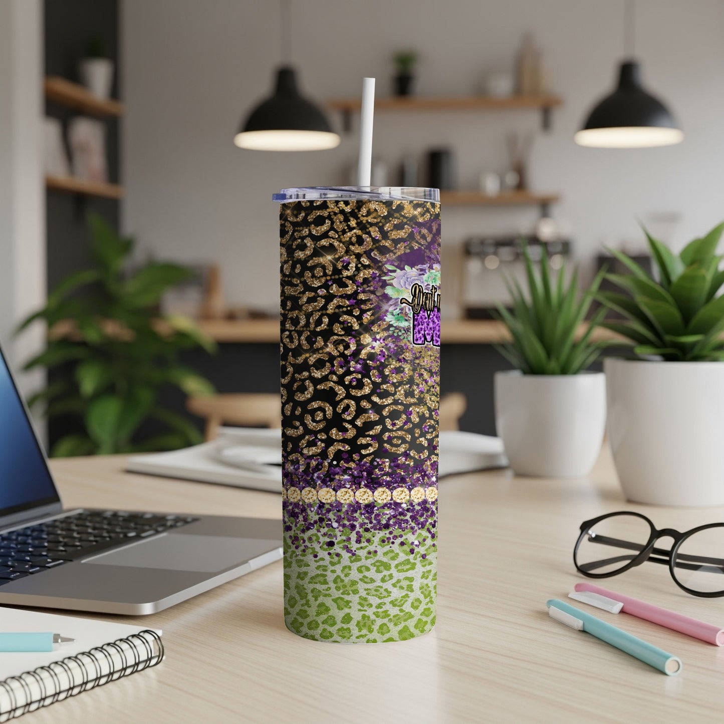 Leopard print tumbler with purple floral design and straw.