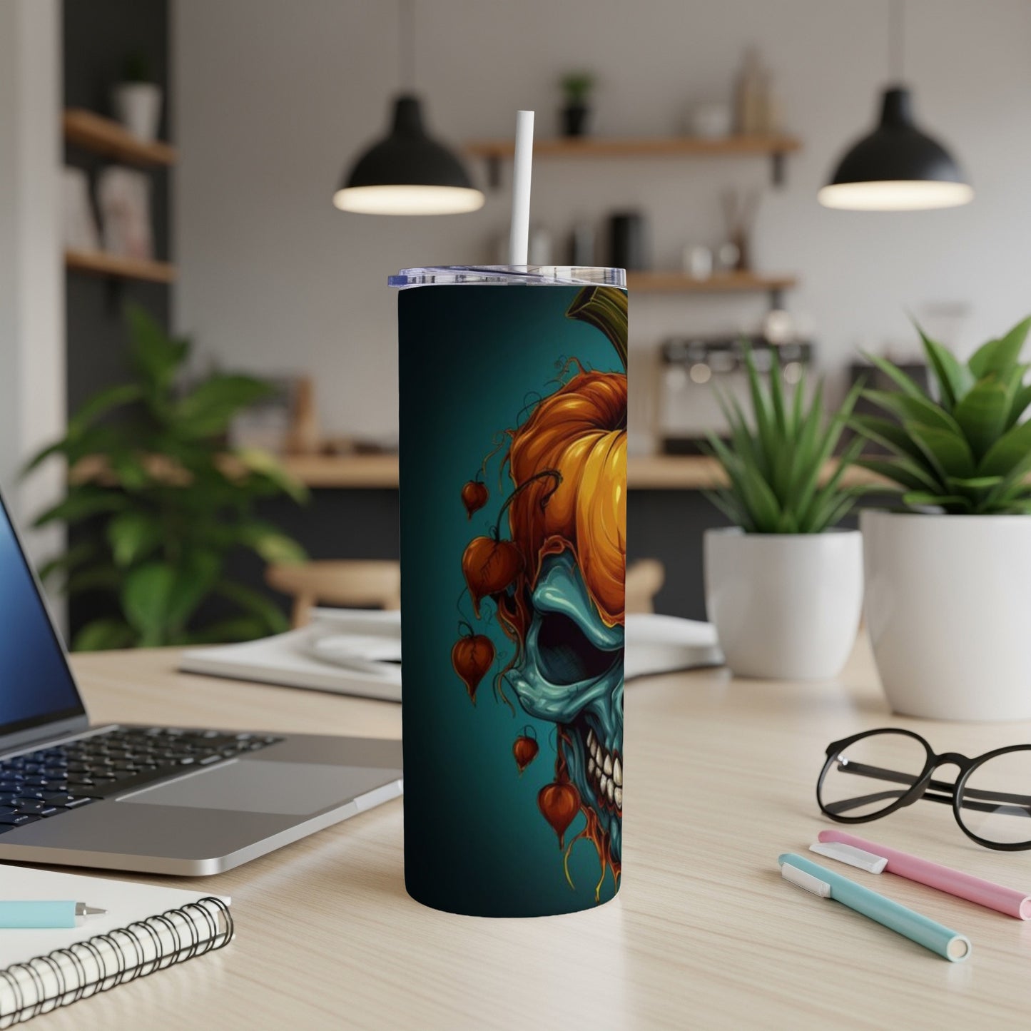 Tall tumbler featuring a half skull, half pumpkin Halloween design.