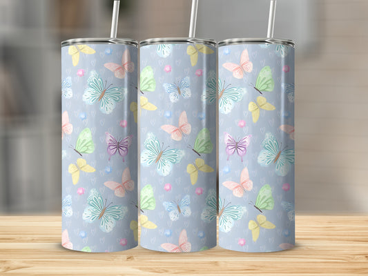Three tumblers with a pale blue background and a pattern of colorful butterflies.