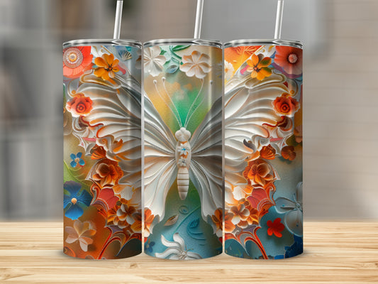 Three tumblers with a white butterfly and floral designs on a wooden surface.