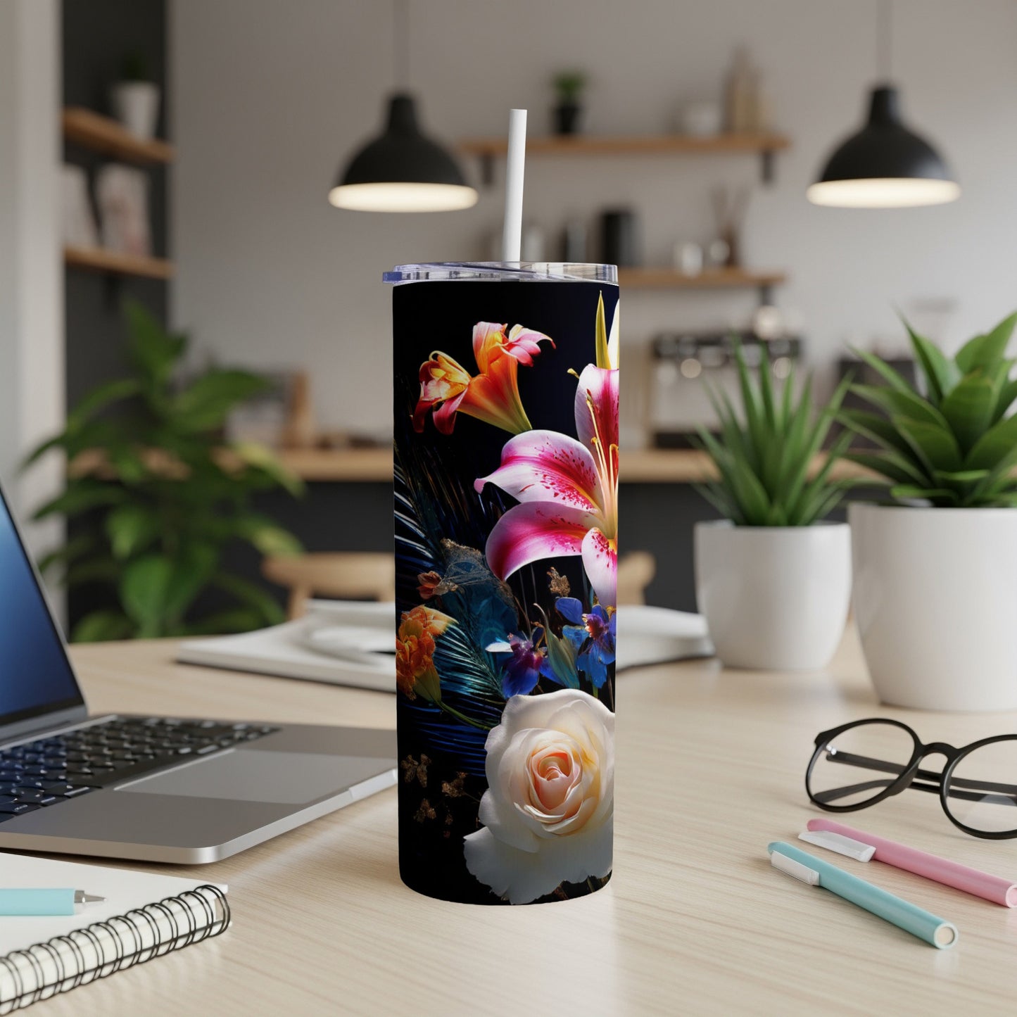Black tumbler with floral design featuring lilies and roses.