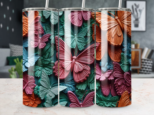 Three tumblers with raised butterfly and leaf designs in pastel colors.