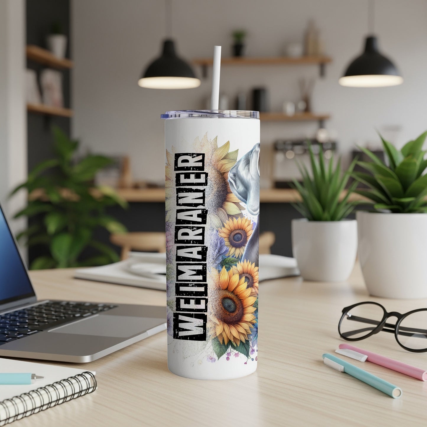 Weimaraner graphic with sunflowers on a white tumbler with a straw.