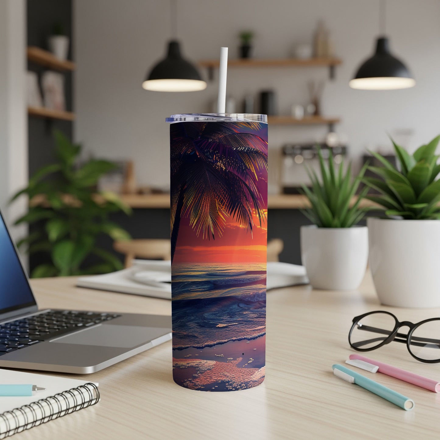 Sunset beach scene on a stainless steel tumbler with straw.