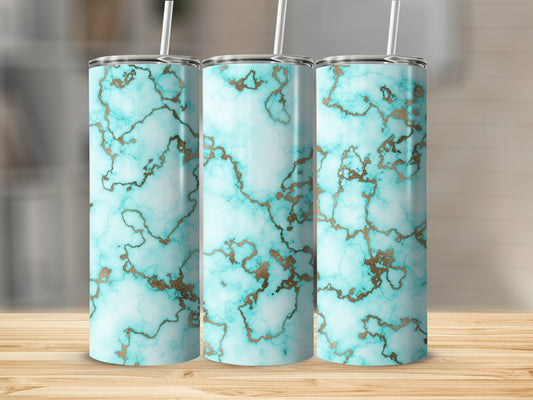 Three tumblers with blue and gold marble patterns displayed on a wooden surface.
