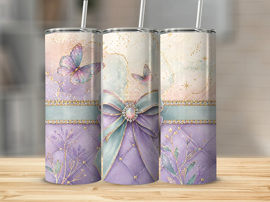 Three tumblers with pastel butterflies, bows, and floral accents.