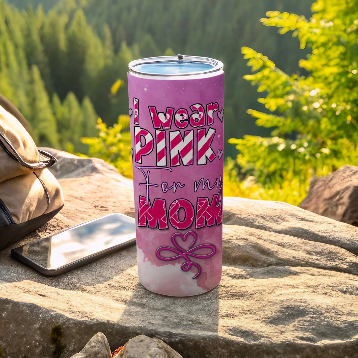 Pink tumbler with "I wear pink for my mom" text and ribbon design.