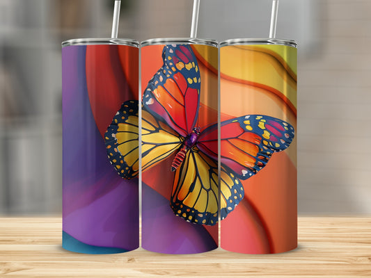 Three tumblers featuring a monarch butterfly design on abstract backgrounds.
