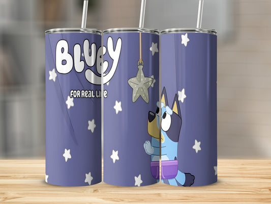 Bluey character tumbler with stars and moon decoration.