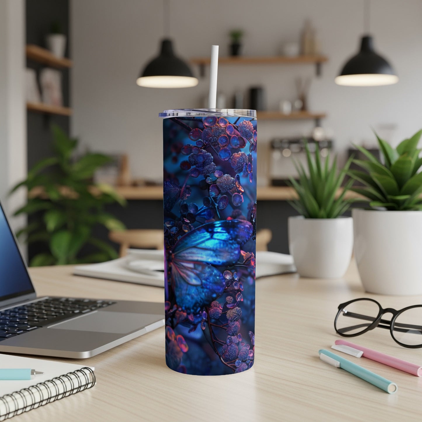 Blue butterfly on a dark floral background on a tumbler with a straw.